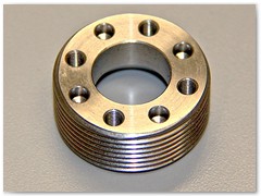 Heat treated stainless steel actuator component  ready for helicoil inserts.